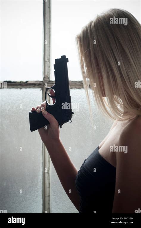 Woman Holding Gun Her Hand Hi Res Stock Photography And Images Alamy