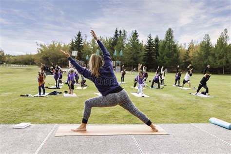 outdoor yoga classes group of adults attending yoga classes in the park editorial photo image