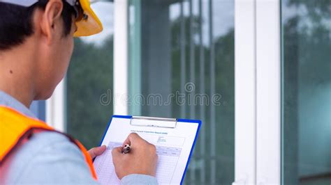 The Inspector Or Engineer Is Checking The Building Structure And The