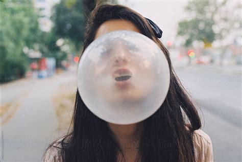 Girl Blowing A Bubblegum By Stocksy Contributor Mak Stocksy