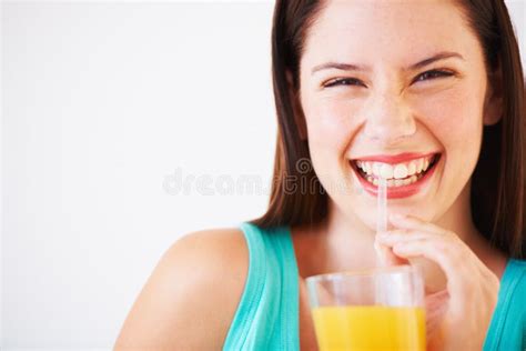I Love My Orange Juice Portrait Of An Attractive Young Woman Smiling