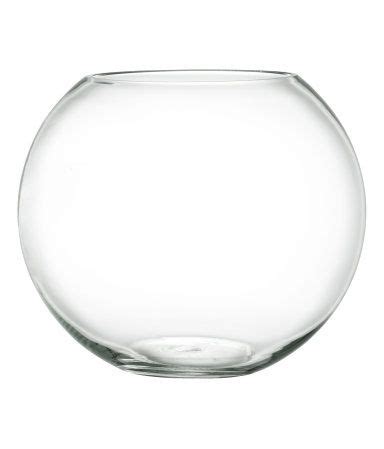 A decorative vase is a stunning accent for any room. Clear glass. Large, round glass vase. Diameter at top 6 in ...
