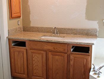 Then i took the cabinets into the bathroom and placed them against the wall. Ornamental Granite Bathroom Vanities in Georgetown Texas