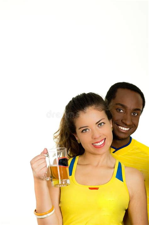Charming Interracial Couple Wearing Yellow Football Shirts Cheering