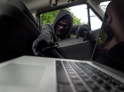 Thief Stealing Laptop From The Car High Quality People Images