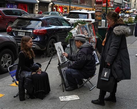 Unidentified Street Artist Drawing Portrait Of Tourist In Midtown