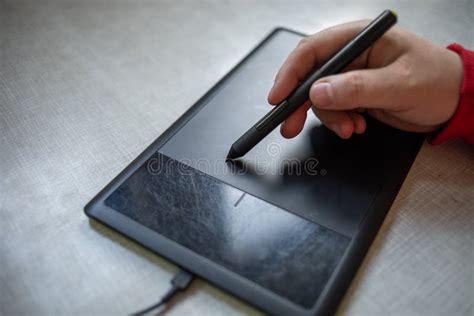 Graphic Table And Pen In Hand Of Artist Stock Photo Image Of