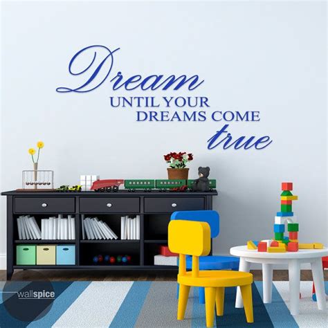 a wall decal that says dream until your dreams come true