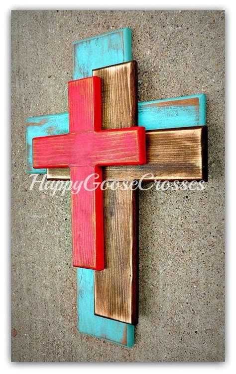 A Wooden Cross Painted Red And Blue On Concrete