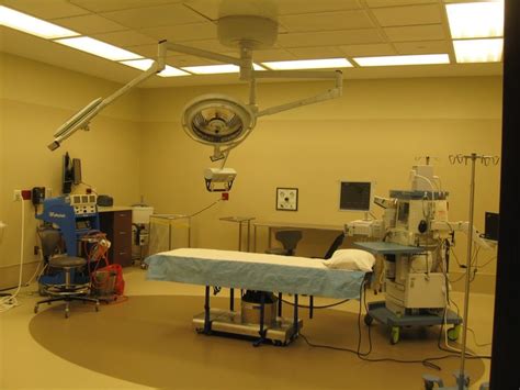 A Hospital Room With Medical Equipment And Lights
