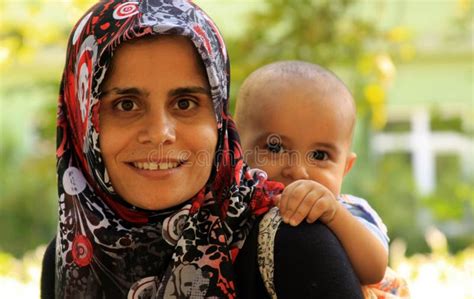 Happy Smiling Arab Muslim Mother Wearing Islamic Hijab Hug Her Baby