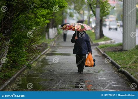 Man Goes Under An Umbrella In The Rain Stock Image Image Of Lifestyle