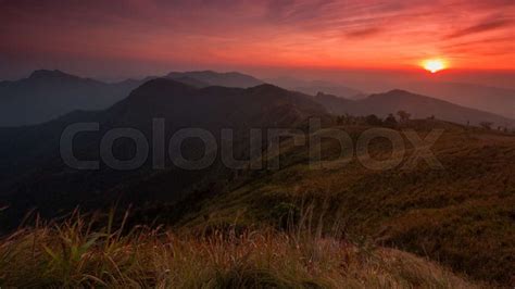 Sunset Scene With The Peak Of Mountain And Cloudscape At Phu Chi Fa In