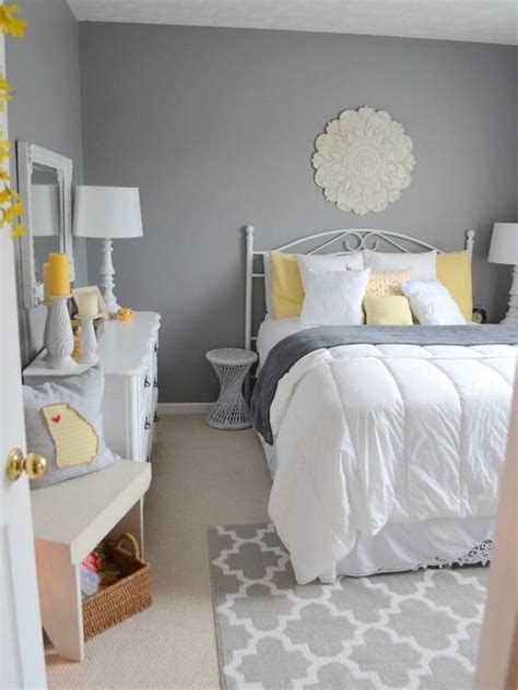 A Bedroom With Gray Walls And Yellow Accents