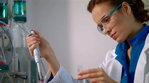 Chemist Woman Working With Chemical Liquid In Lab Closeup Female