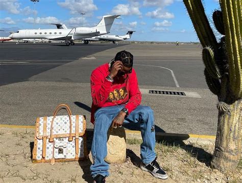 Spotted Travis Scott Relaxes Runway Side In Supreme Louis Vuitton X
