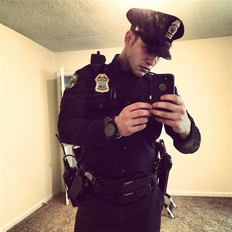 cops like taking selfies too hot cops puffy coat taking selfies men in uniform canada goose