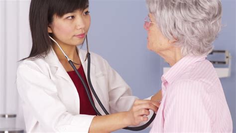 Asian Doctor Listening To Elderly Patient S Heart Stock Footage Video 6609389 Shutterstock