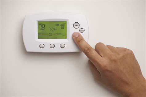 Male Hand On Digital Thermostat Set At 78 Degrees Murphy Miller