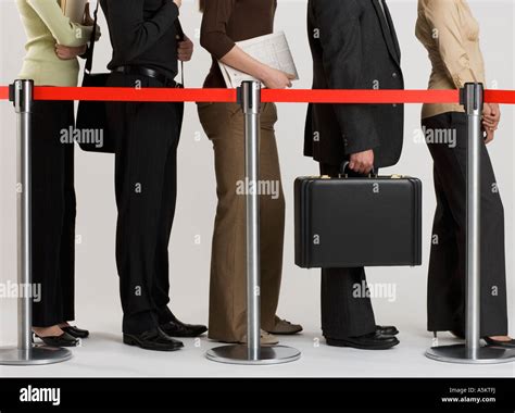 Group Of People Standing In Line Stock Photo Alamy