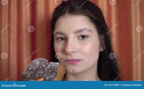 Young Woman Greedily Eats Cake With Chocolate Bites A Loaf Bakary