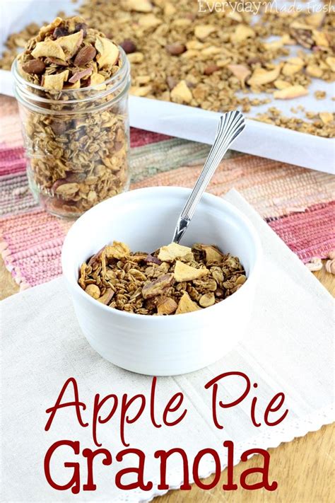 An Apple Pie Granola In A White Bowl On A Table With A Spoon And Napkin