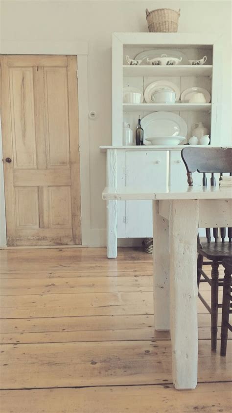 When using wood, one important but often overlooked aspect is to check if the wood being used is locally available. Wide plank pine floors and white furniture. Simplistic farmhouse style. | Wood floors wide plank ...