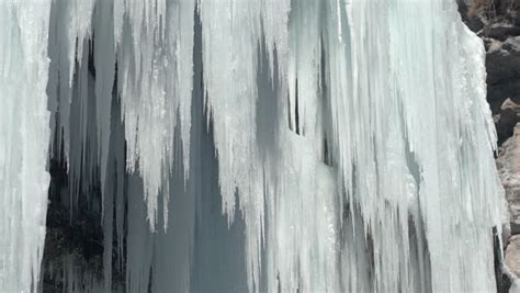 Aerial Winter River Cascade Frozen Into White Sparkling Icicles