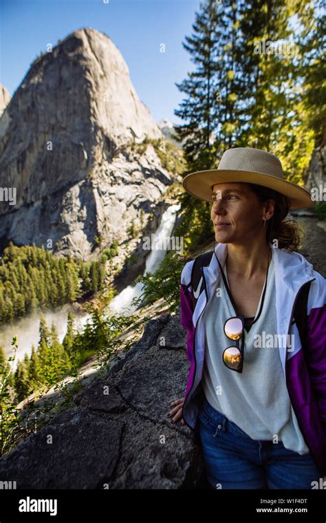 Tourist Woman Posing In Shade John Muir Trail With Nevada Fall And