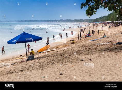 Indonesia Bali Kuta Tourists On Beach Stock Photo Alamy