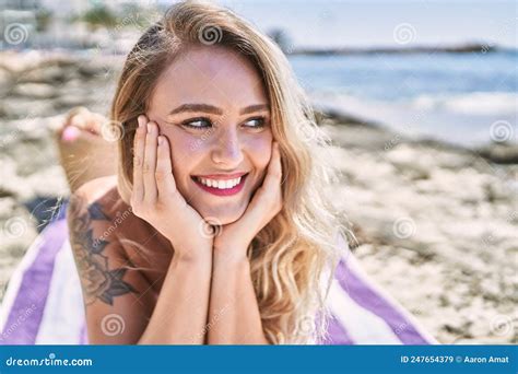 Young Blonde Girl Wearing Bikini Lying On The Towel At The Beach Stock Image Image Of Natural