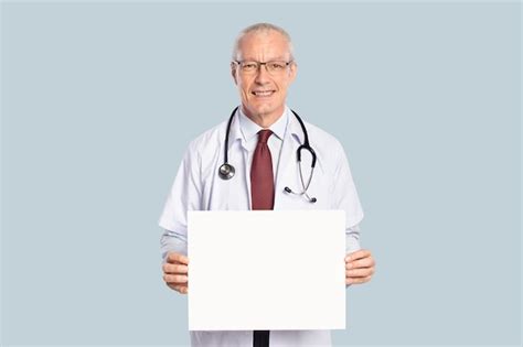 Free Photo Male Doctor Showing A Blank Sign Board