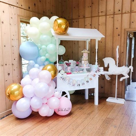 Candy Cart With Pastel And Gold Balloon Garland Decor For A First
