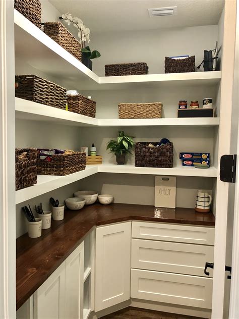 A Pantry With A Counter Top Shelves And Cabinets Drawers Makes For An