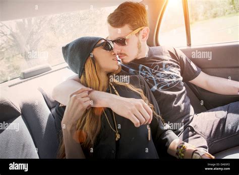 Couple On Backseat In Car Kissing Stock Photo Alamy