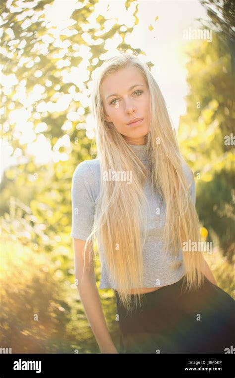 Portrait Serious Beautiful Blonde Teenage Girl Outdoors Stock Photo