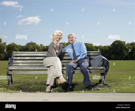 Elderly Couple On A Park Bench Stock Photo Alamy