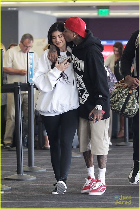 kylie jenner gets a big kiss from tyga at the airport photo 994475 photo gallery just