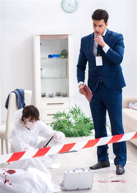 Forensics Investigator At The Scene Of Office Crime Stock Photo Image