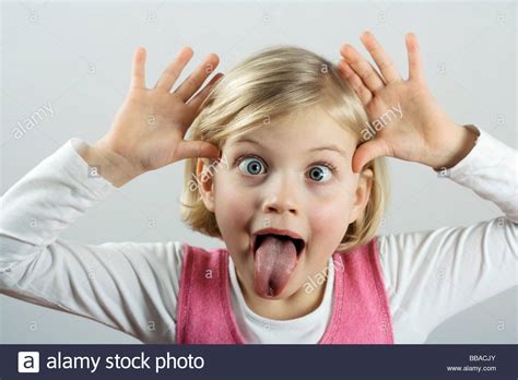 A Little Girl Making A Funny Face Stock Photo Alamy