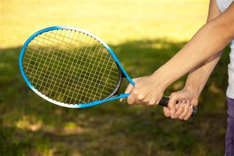 Female Hands Holding A Tennis Racket Stock Photo Image Of Female