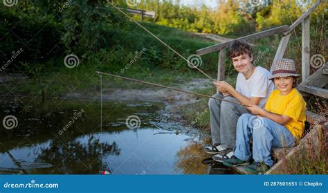 Happy Boys Go Fishing On The River Two Children Of The Fisherman With