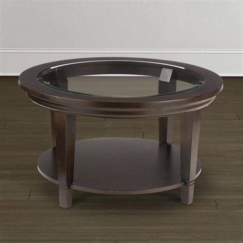 Coffee tables to keep everything handy. round cocktail table with glass top easton bassett ...