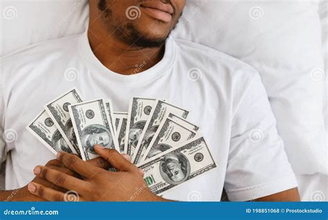 African Man Sleeping Holding Money Lying In Bed At Home Stock Photo Image Of Black Afro