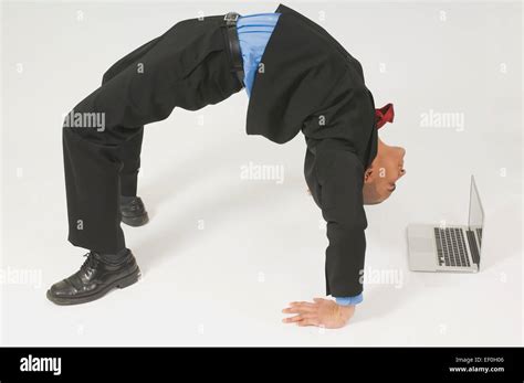 Business Man Bending Over Backwards Hi Res Stock Photography And Images