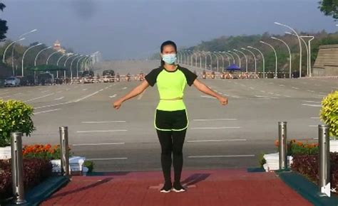 The woman dances as the coup goes on behind her. Myanmar Aerobics Teacher Refuses to Let Coup Interrupt Her Workout