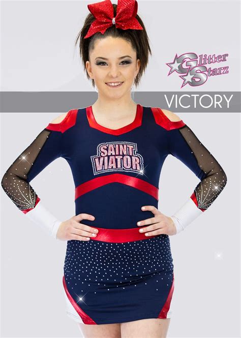 a woman in a cheer uniform with her hands on her hips and the words victory written