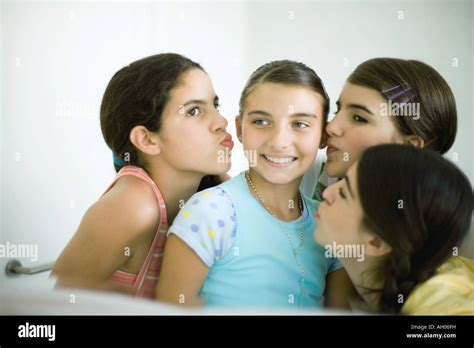 teenage girls kissing cheek fotos und bildmaterial in hoher auflösung alamy