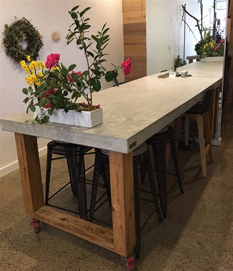 Rectangular Polished Concrete Dining Table With Loop End Timber Base