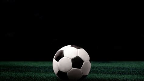 White Black Football On Green Grass In Black Background Hd Football